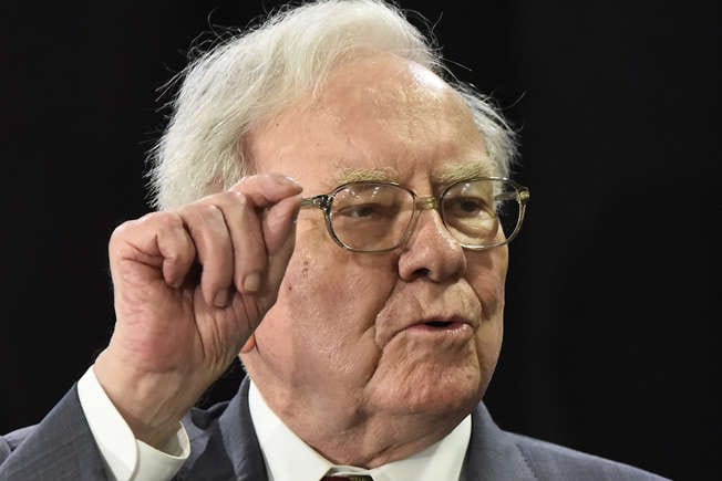 Bitcoin skeptic Warren Buffett, whose own company profits from Bitcoin.
